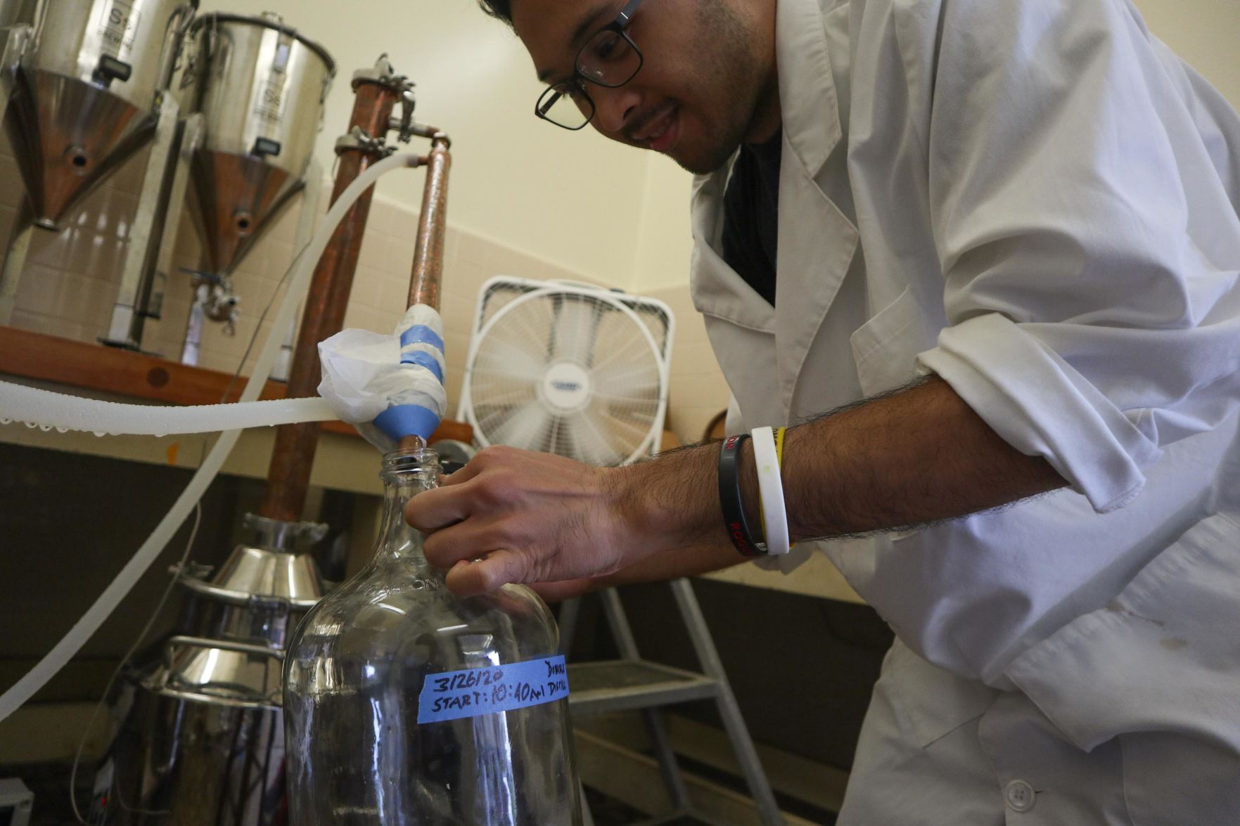 UH lab student creating hand sanitizer
